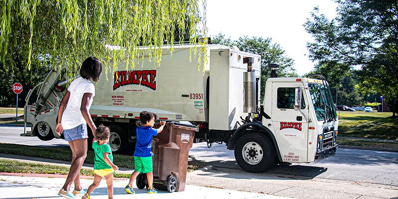 Rumpke Truck Collecting Waste From Local Community Customers 1