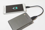 Smartphone Plugged Into Lithium Ion Battery