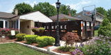 A Rumpke Open Top Dumpster In A Residential Driveway For Bulk Trash