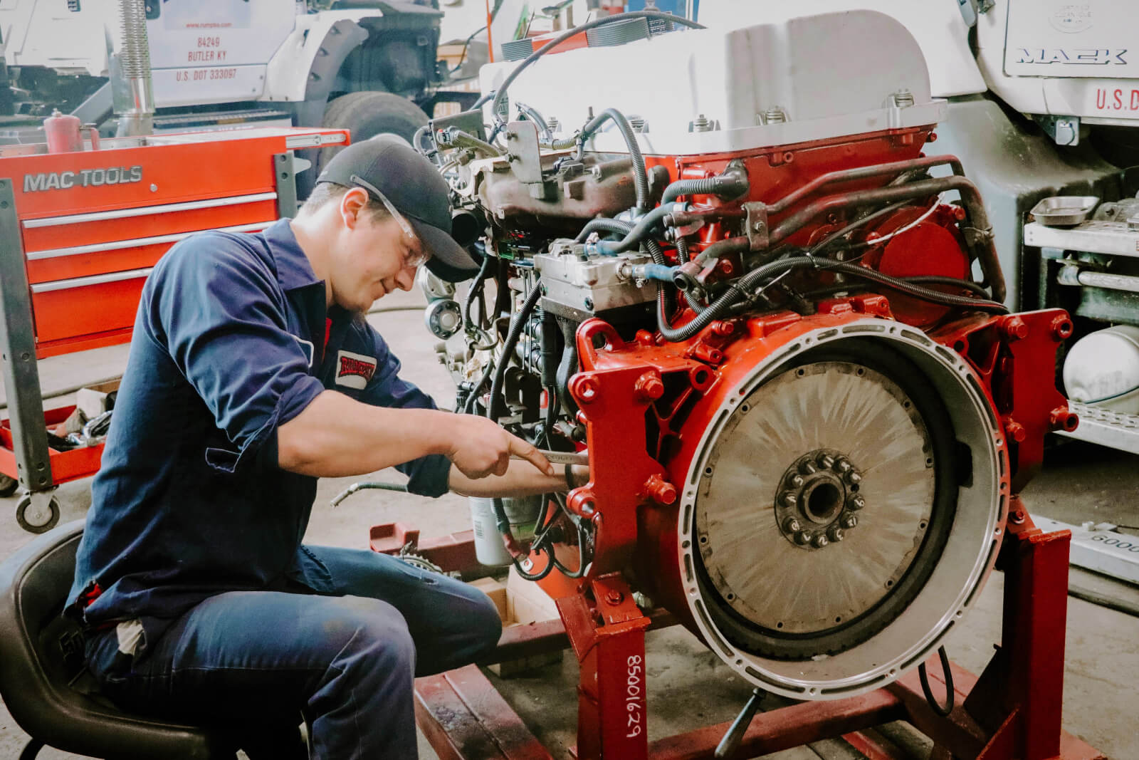 Rumpke Mechanic Working On Machine For Hydraulic Repair Service