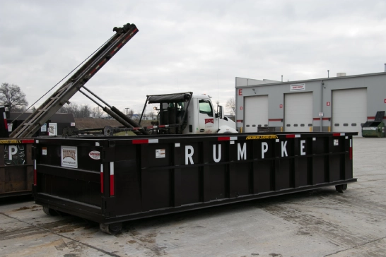 20 Yard Dumpster Next To Roll Off Truck