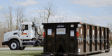 Rumpke Roll Off Dumpster In Front Of Rumpke Roll Off Truck